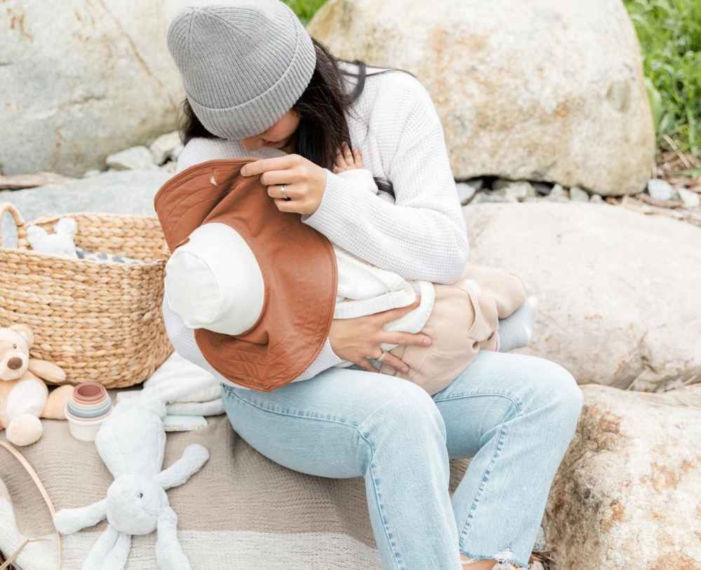 Ditch Bulky Nursing Covers: Introducing the Essential Breastfeeding Hat for Moms